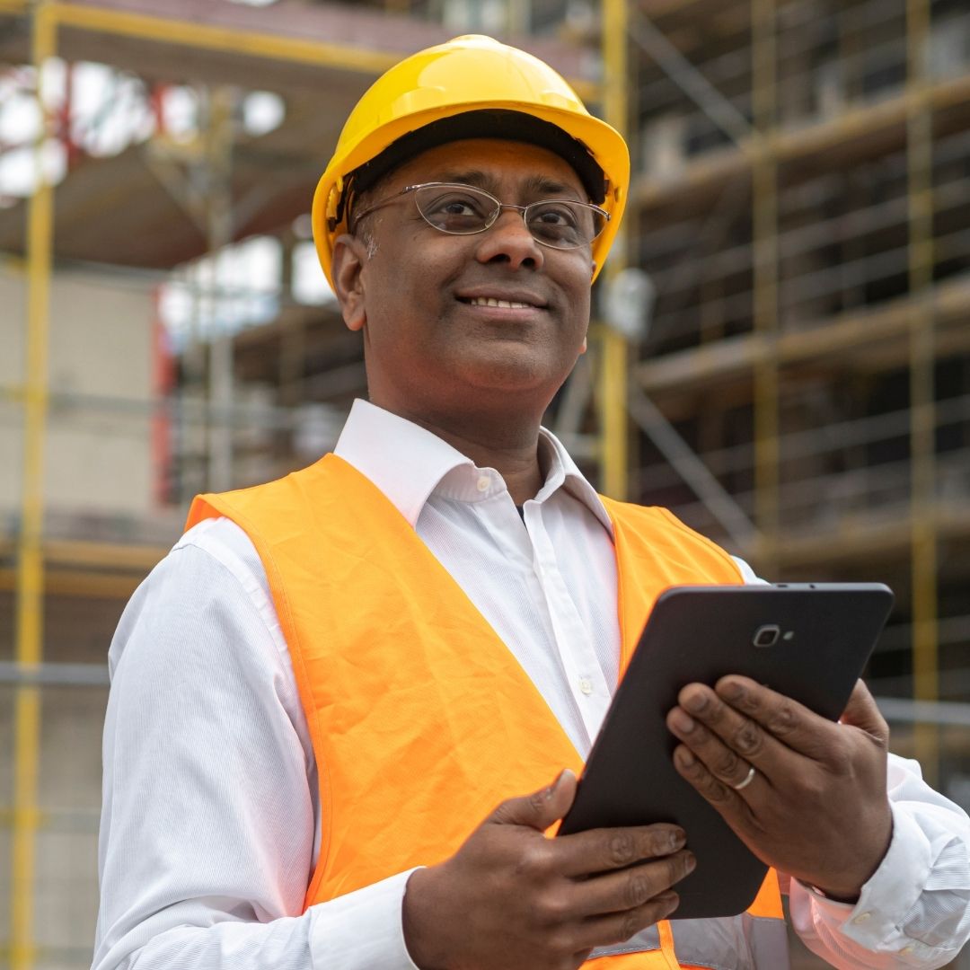 transportation logistics manager holding a tablet
