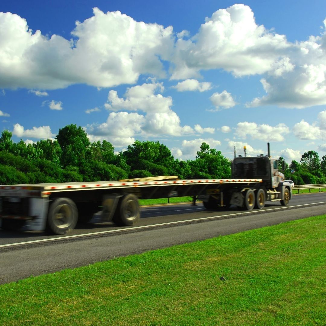 flatbed trailer on the highway
