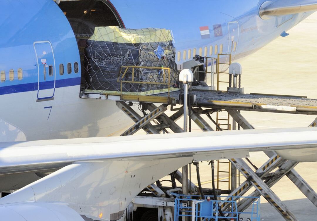 Image of a plane being loaded with cargo
